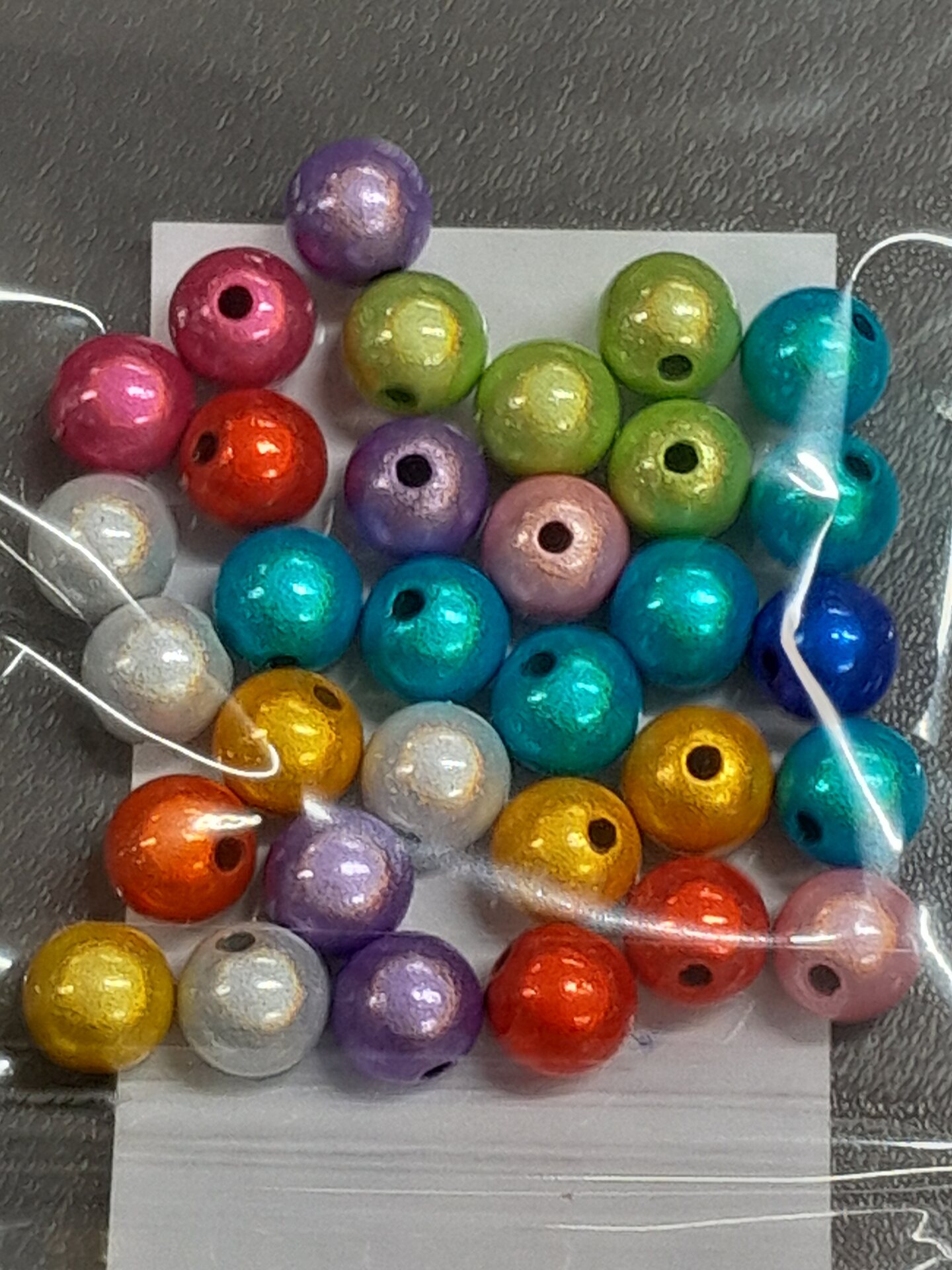 Heijastavia helmiä 8mm n.30kpl Mehrfarbig